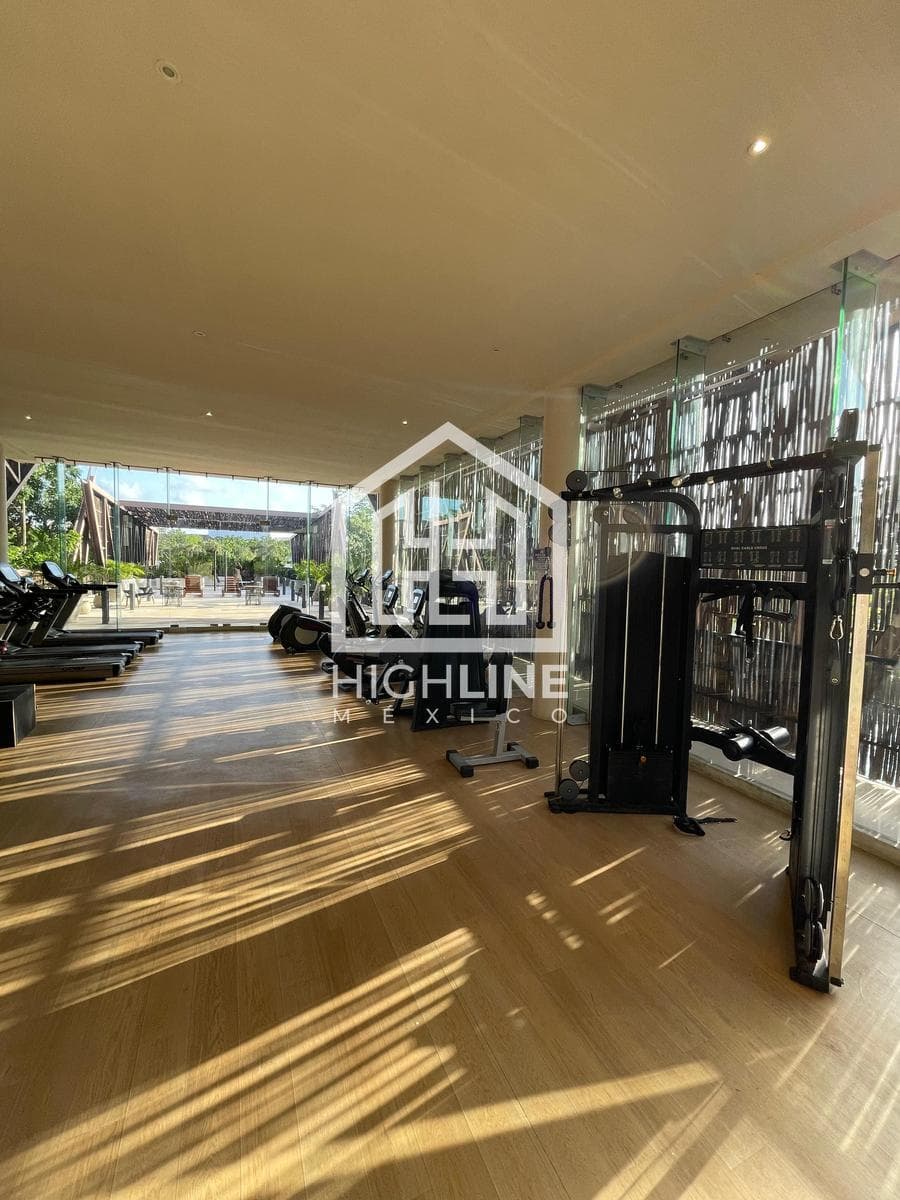 2-bedroom apartment for sale in Tulum with a large pool, gym, and pet-friendly policy