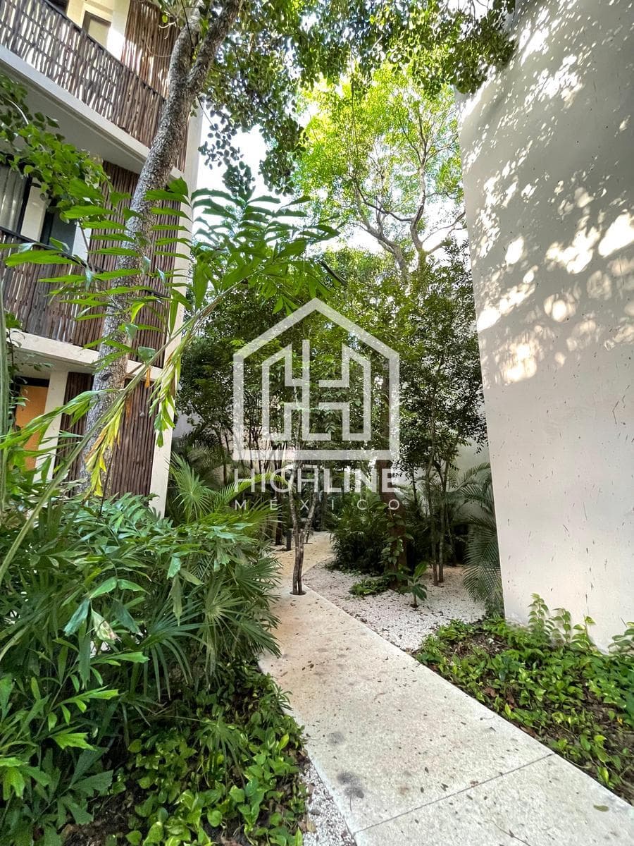 2-bedroom apartment for sale in Tulum with a large pool, gym, and pet-friendly policy