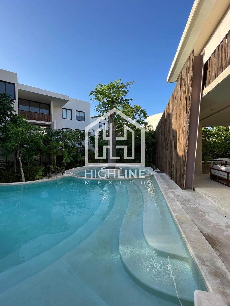 2-bedroom apartment for sale in Tulum with a large pool, gym, and pet-friendly policy