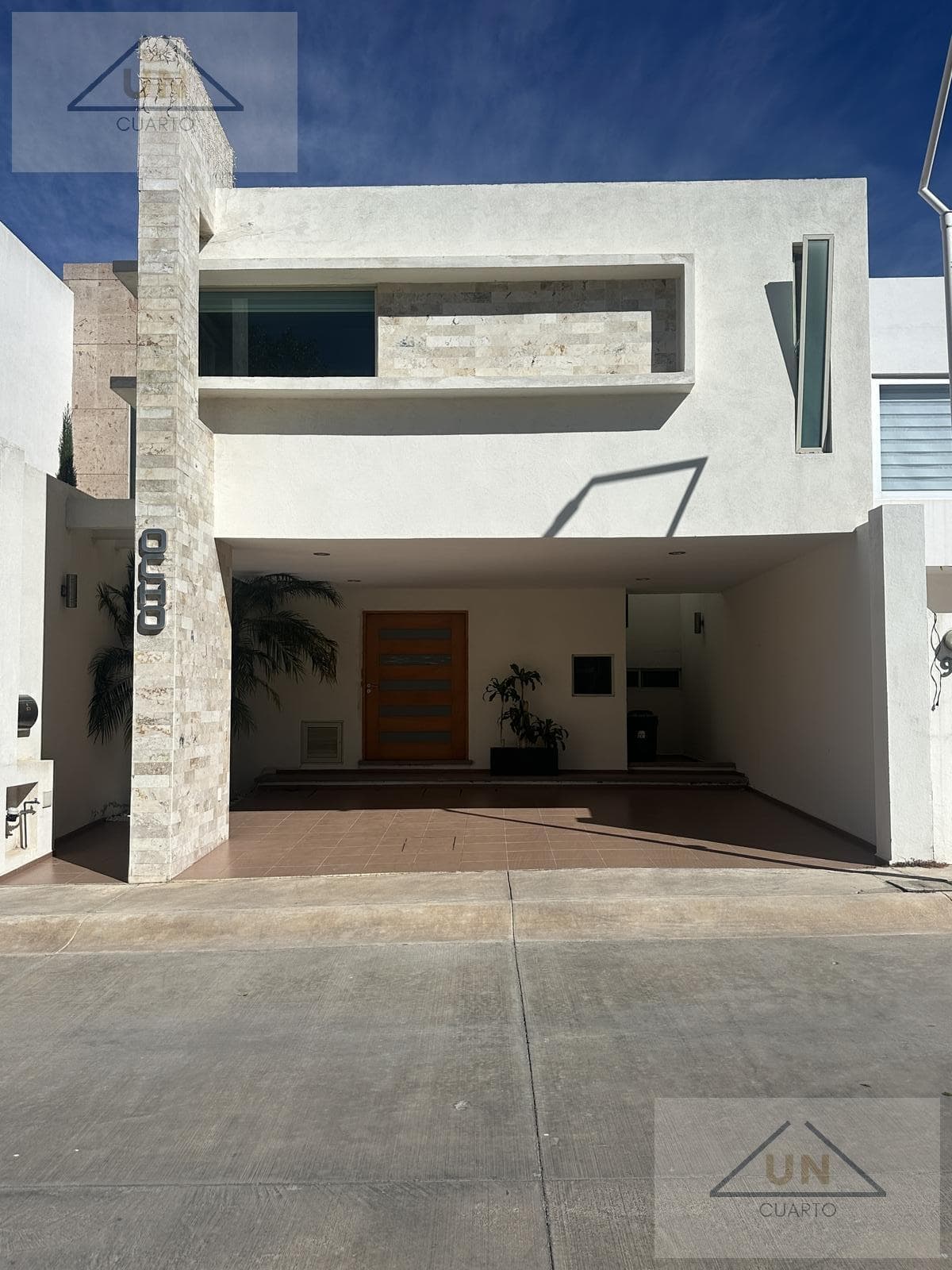 House facing a green space