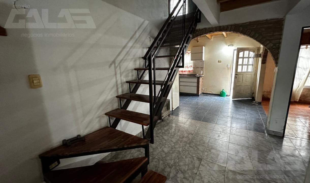 4-room house for sale with a patio, barbecue, and covered garage in Ituzaingó