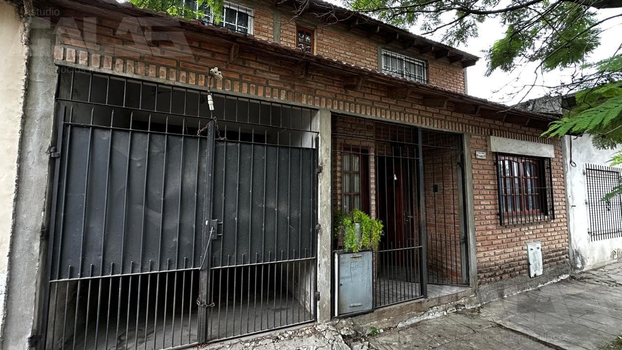 4-room house for sale with a patio, barbecue, and covered garage in Ituzaingó