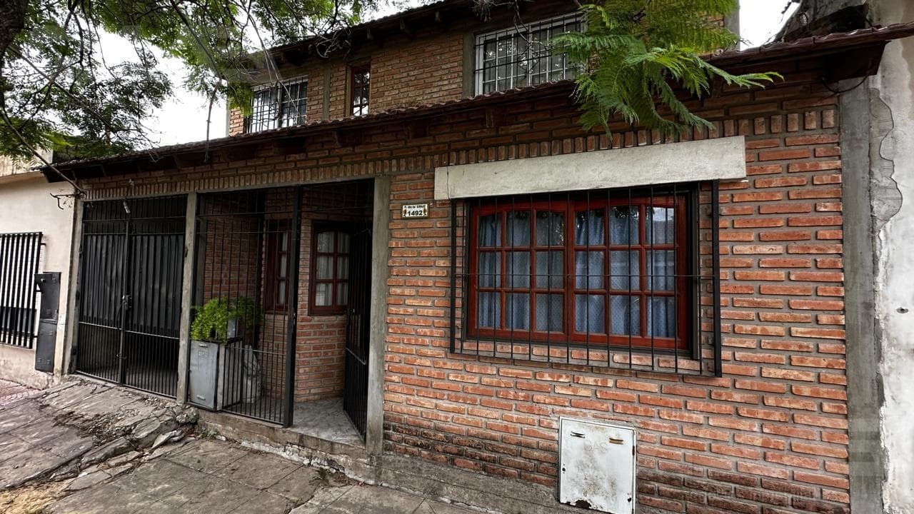 4-room house for sale with a patio, barbecue, and covered garage in Ituzaingó