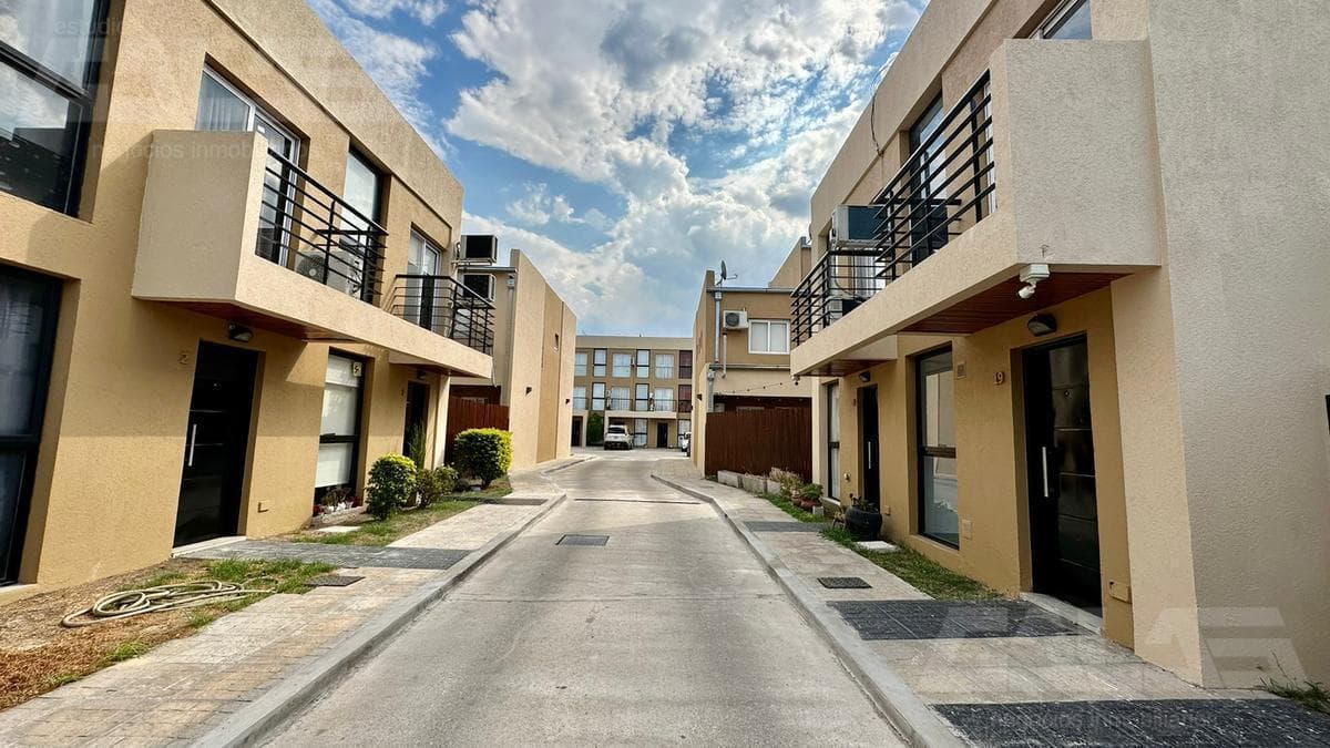 3-bedroom duplex in a gated community, with a garage, open lot, and security, plus low maintenance fees
