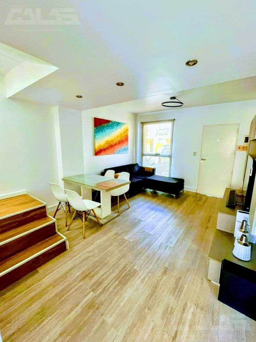 3-bedroom duplex in a gated community, with a garage, open lot, and security, plus low maintenance fees