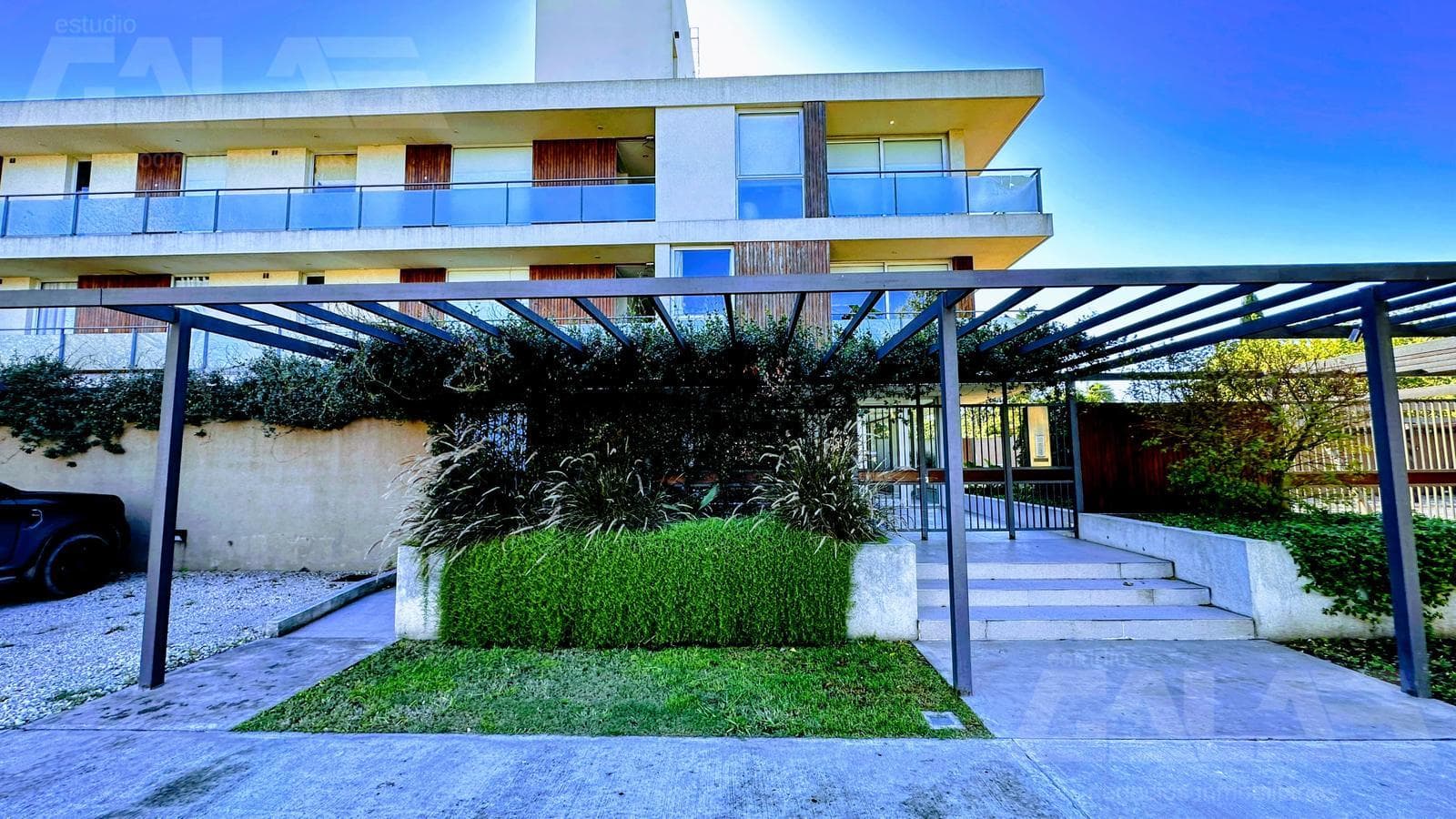 3 premium-style units on the ground floor with a garden, heated pool, and 2 covered parking spaces