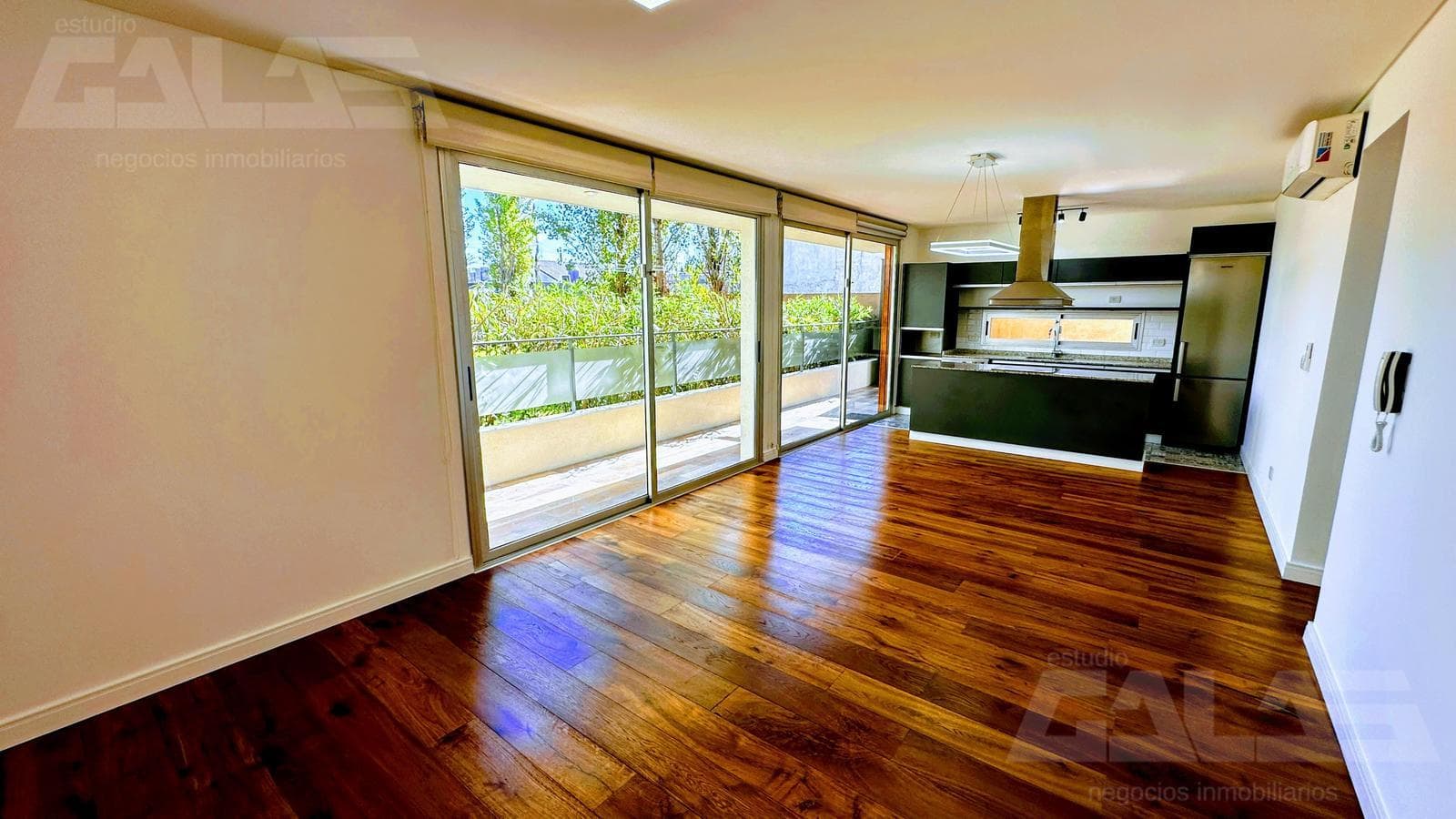 3 premium-style units on the ground floor with a garden, heated pool, and 2 covered parking spaces