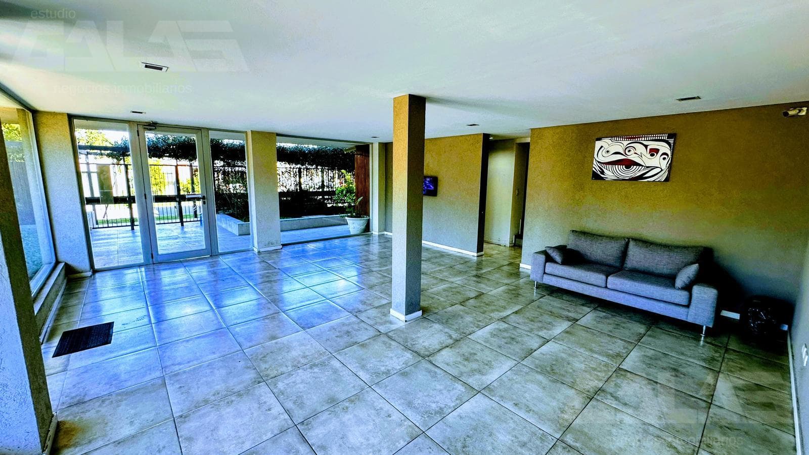 3 premium-style units on the ground floor with a garden, heated pool, and 2 covered parking spaces