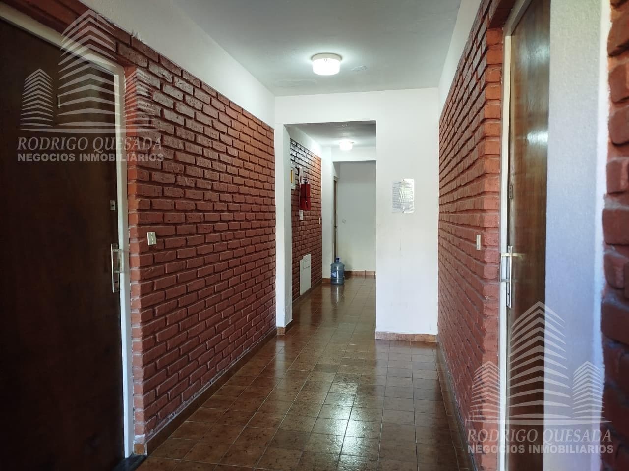 Studio apartment with 2 patios—barbecue area and laundry area.