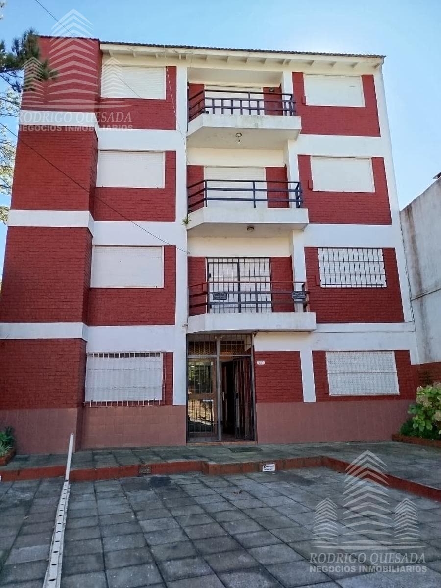 Studio apartment with 2 patios—barbecue area and laundry area.