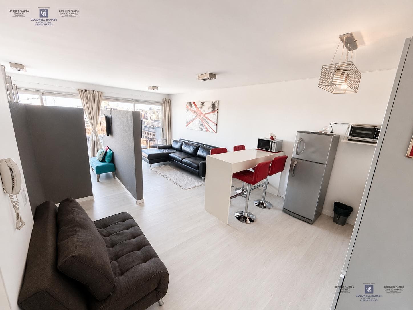 Furnished studio apartment for sale, with partitionable layout, balcony, garage, and full amenities in Puerto Madero