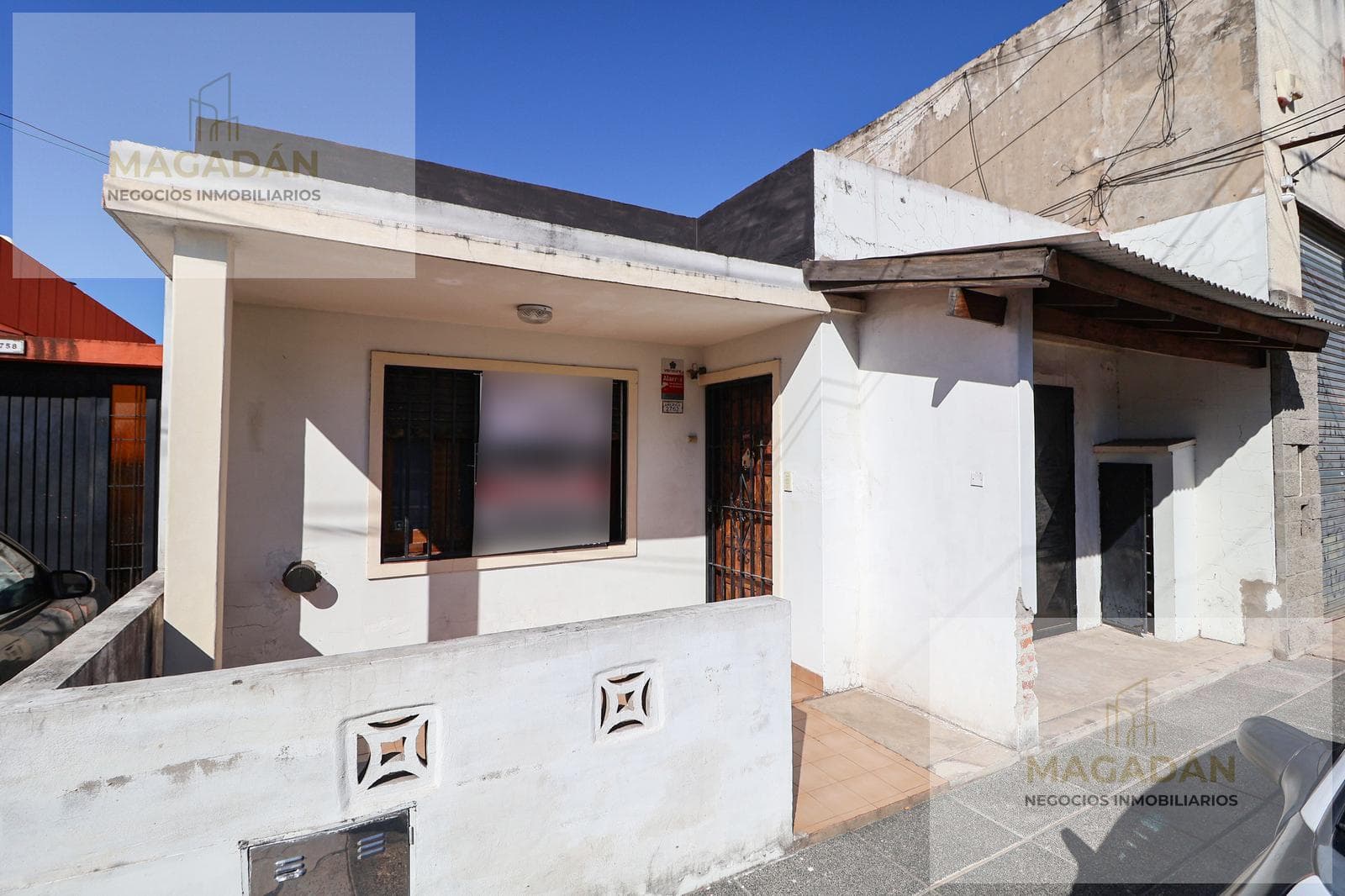 For Sale—3-room townhouse on the street with a patio—WILL CONSIDER TRADE