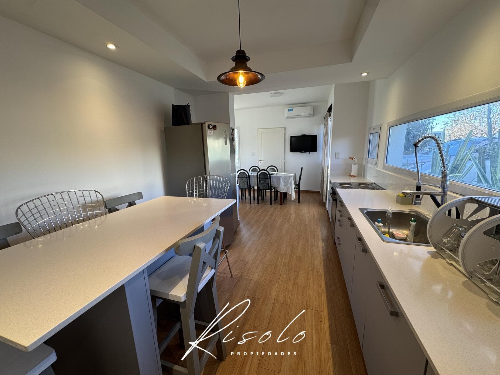 House for sale with a lot overlooking the lagoon and a pool on the island. Gated community, Escobar