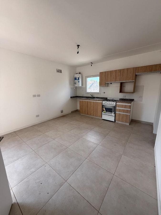Brand-new half-floor apartment with balcony, garage, and barbecue area