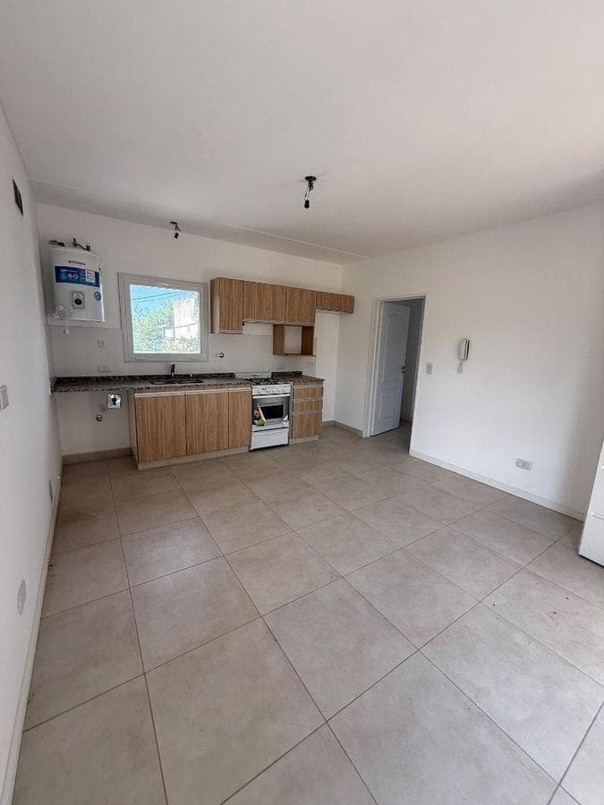 Brand-new half-floor apartment with balcony, garage, and barbecue area