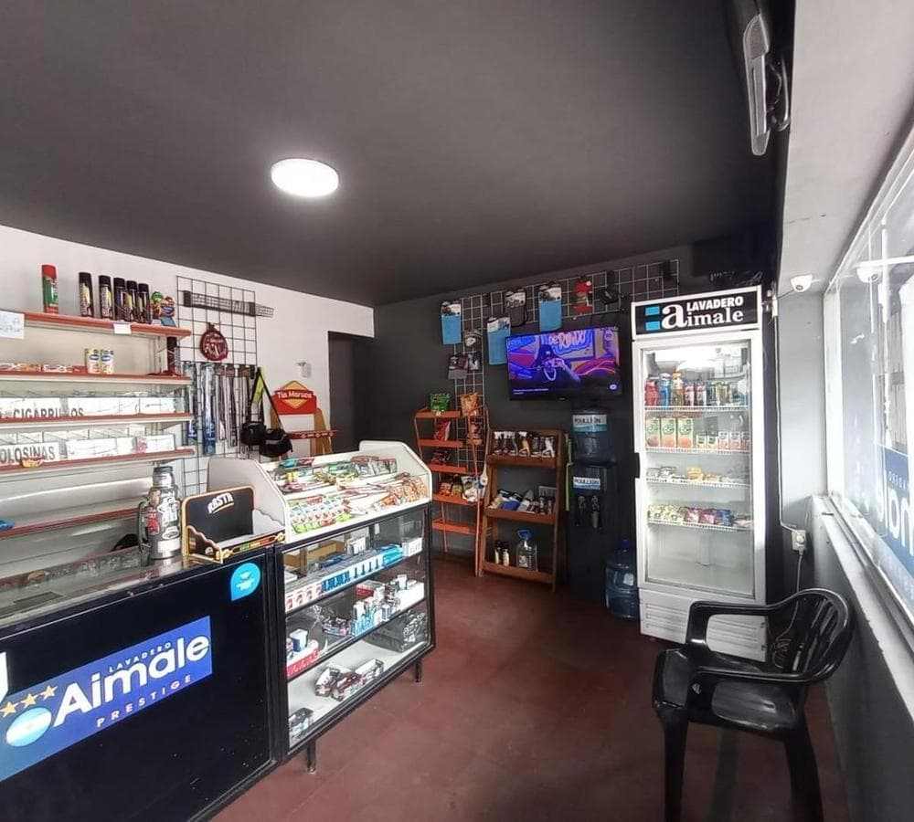 FOR SALE: COMMERCIAL CORNER PROPERTY—OPERATING LAUNDRY BUSINESS