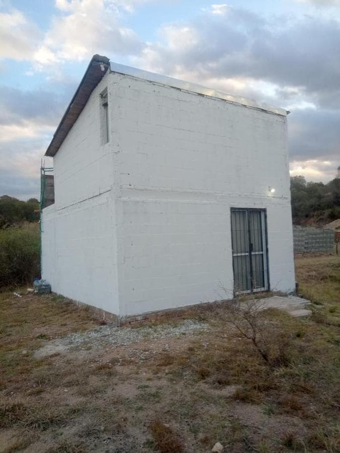 House on a large lot—needs finishing. Great opportunity. Trade accepted.