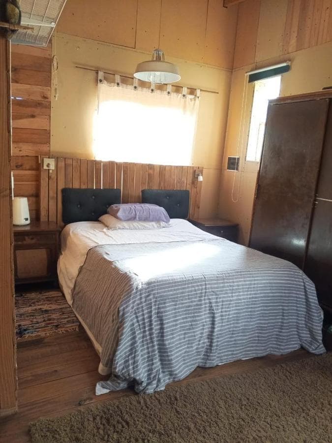 Cabin-style house, built using a wood-frame construction system.
