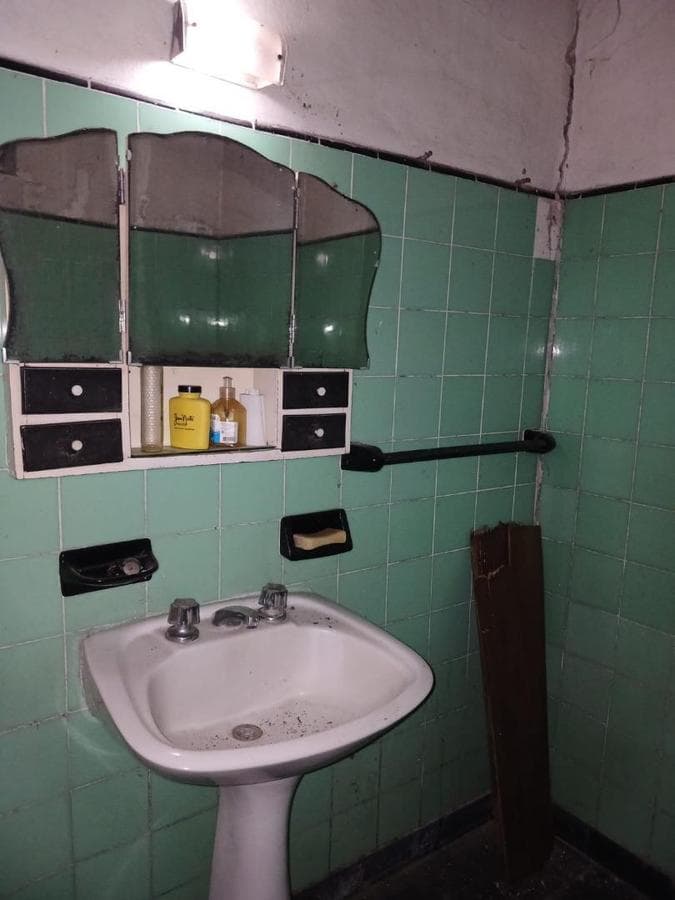 House in Need of Renovation with Large Lot