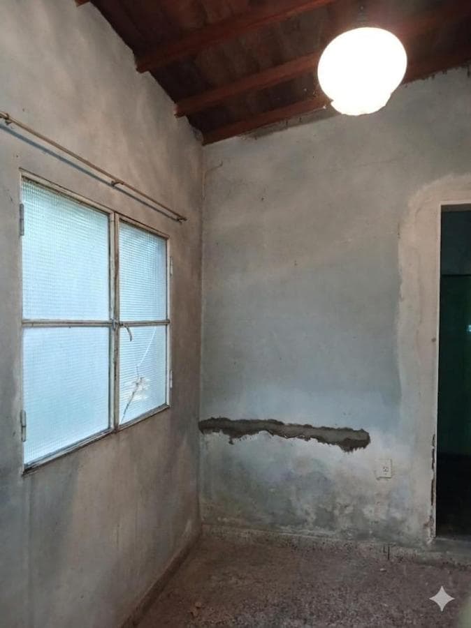 House in Need of Renovation with Large Lot