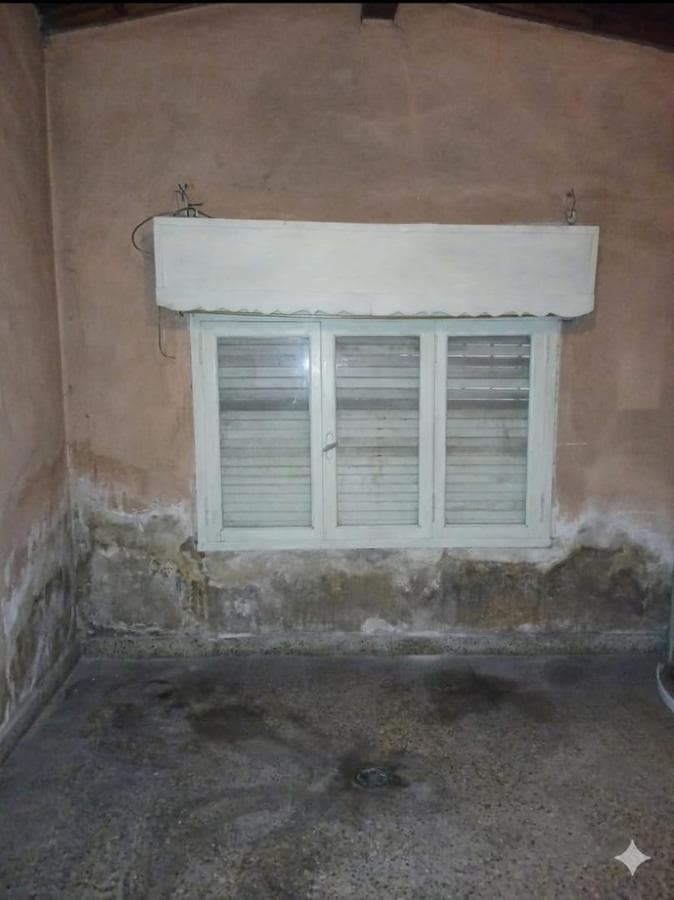 House in Need of Renovation with Large Lot