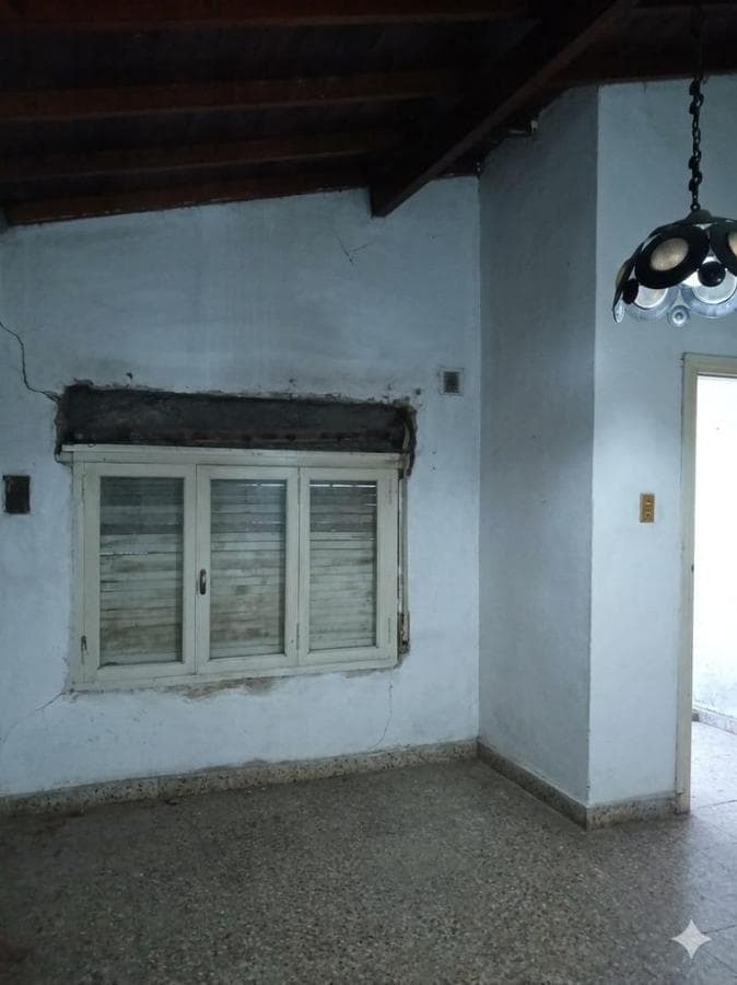 House in Need of Renovation with Large Lot