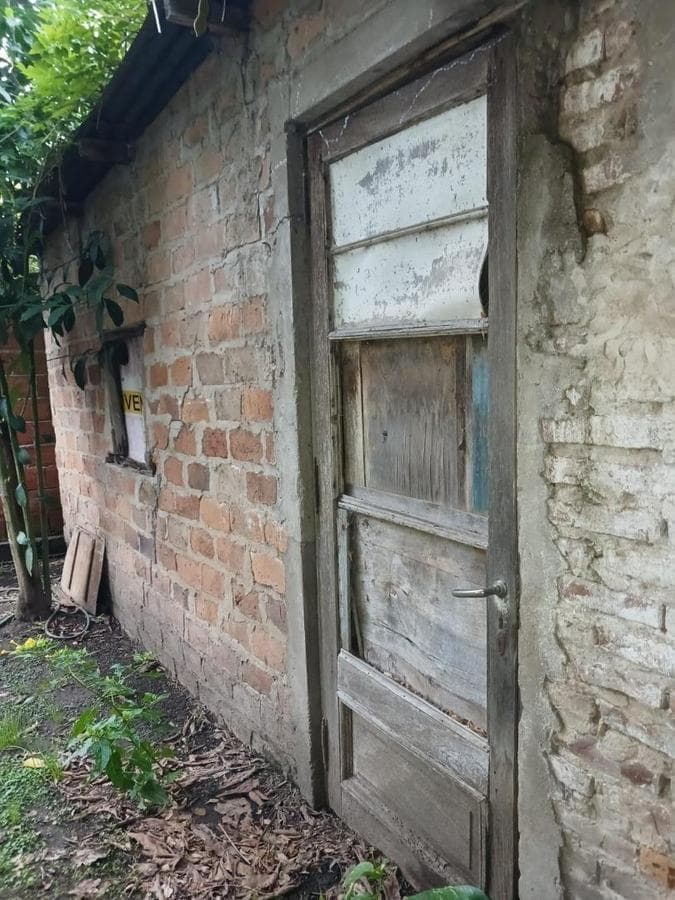 House in Need of Renovation with Large Lot