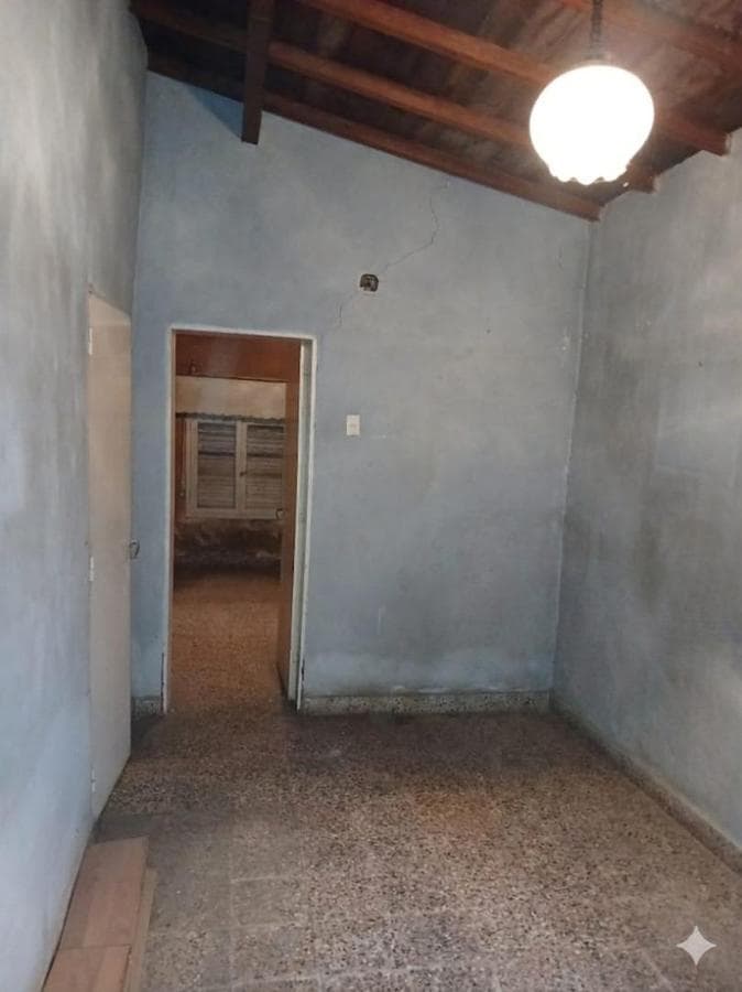 House in Need of Renovation with Large Lot