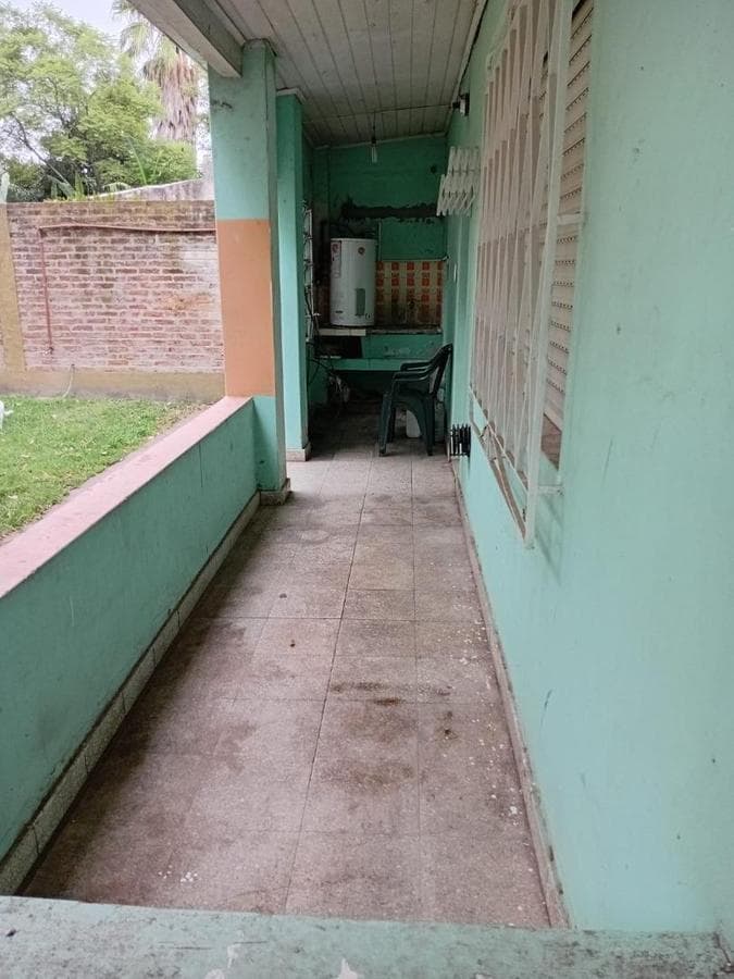 Multifamily home with 2 four-room houses on a large lot