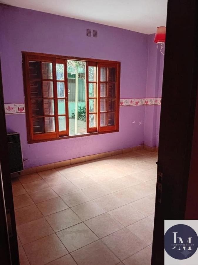 Multifamily home with 2 four-room houses on a large lot