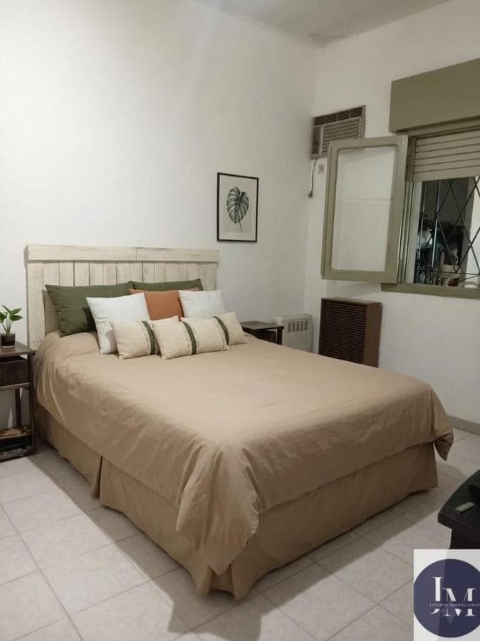 Multifamily home with 2 four-room houses on a large lot