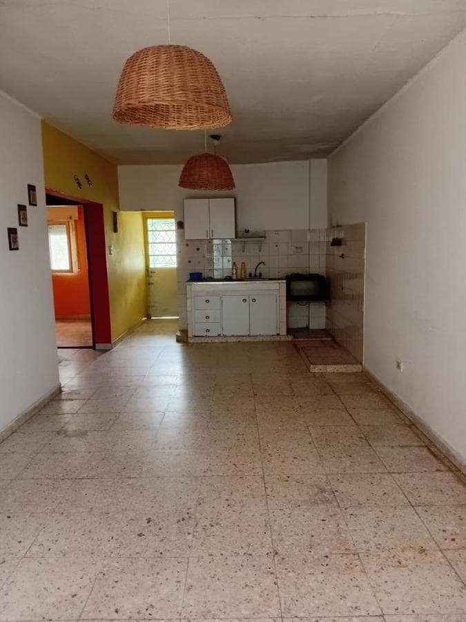 Multifamily home with 2 four-room houses on a large lot