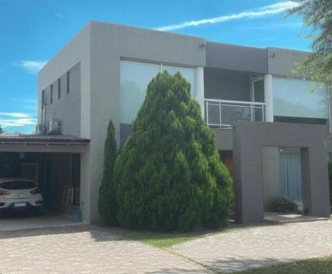 MINIMALIST HOME ON A CENTRAL LOT AT CLUB CAMPO LOS PUENTES