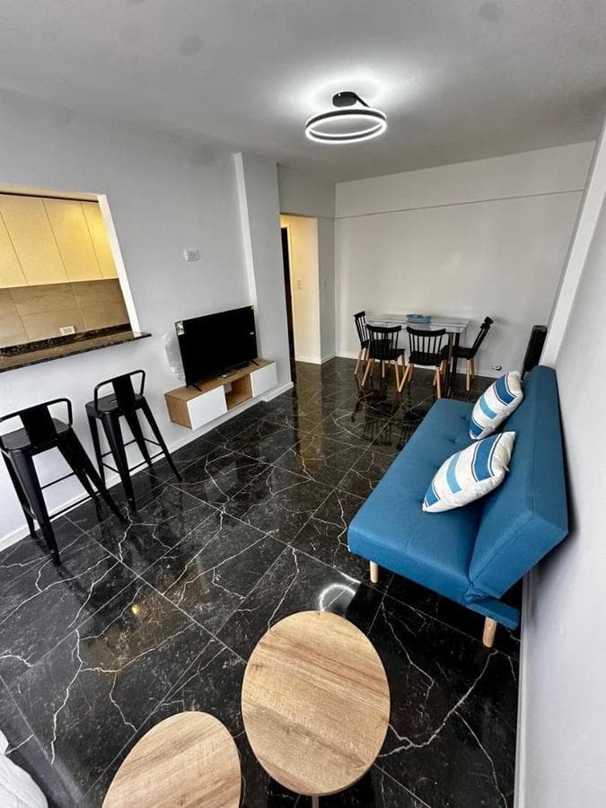 TWO OPEN-CONCEPT ROOMS FACING EACH OTHER WITH A FRENCH BALCONY