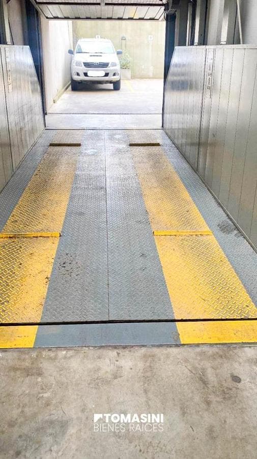 COVERED PARKING SPACE, ACCESS VIA FREIGHT ELEVATOR