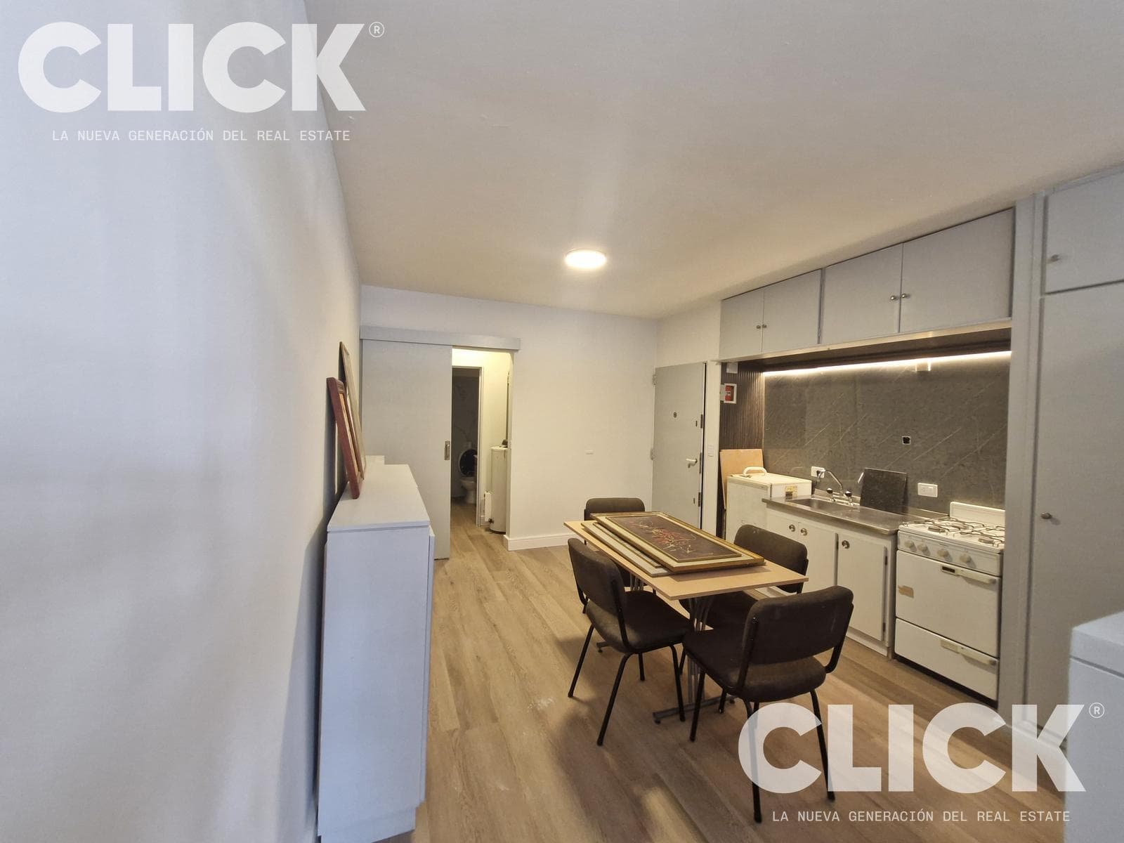 Renovated studio apartment with a balcony, attached garage, and 2 storage rooms