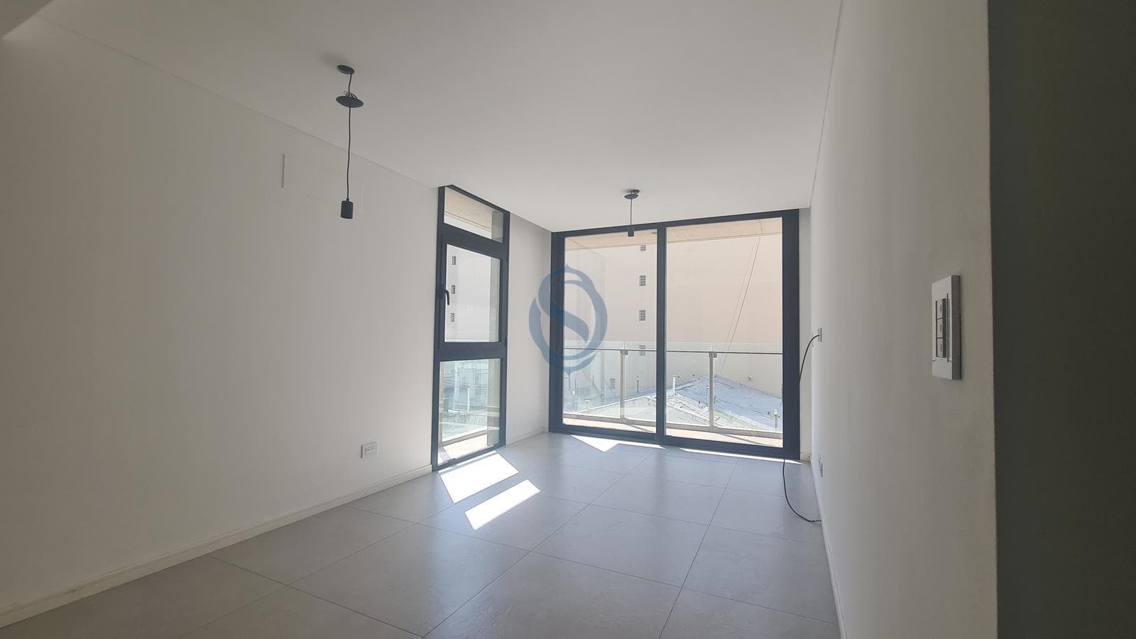 Two-room apartment facing the rear of a modern, high-end building