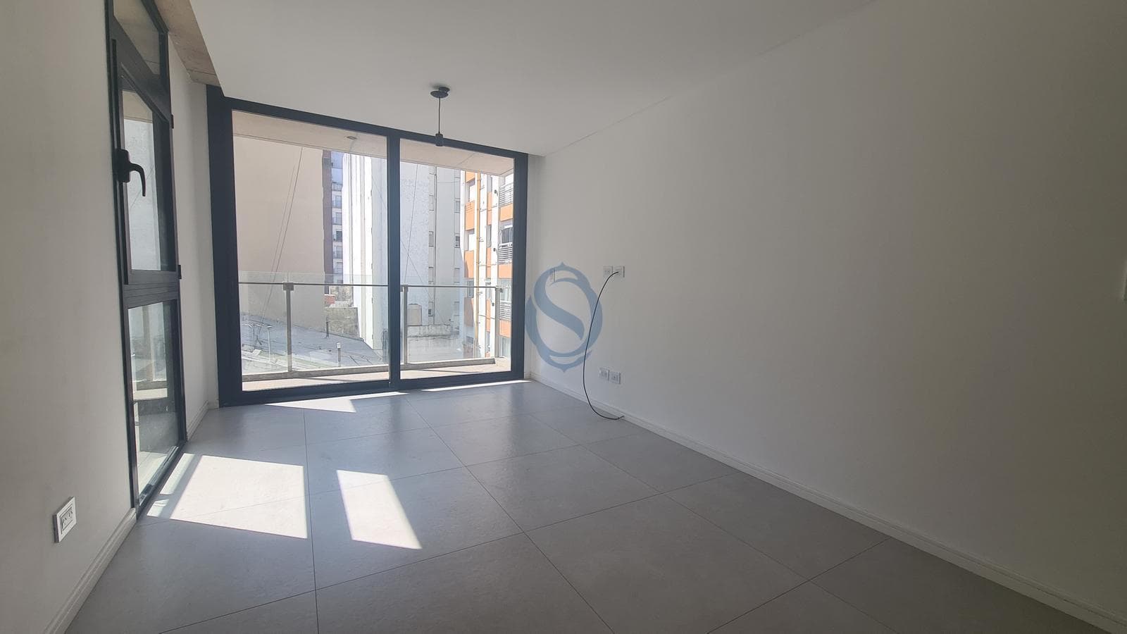 Two-room apartment facing the rear of a modern, high-end building