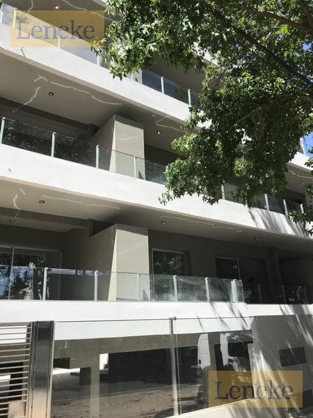 For sale with rental income: excellent 2-bedroom apartment with a balcony/terrace, barbecue, and garage