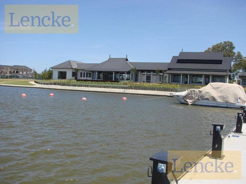 Lencke Vende - A very nice lot in Albanueva across from the river with excellent views and a boat slip