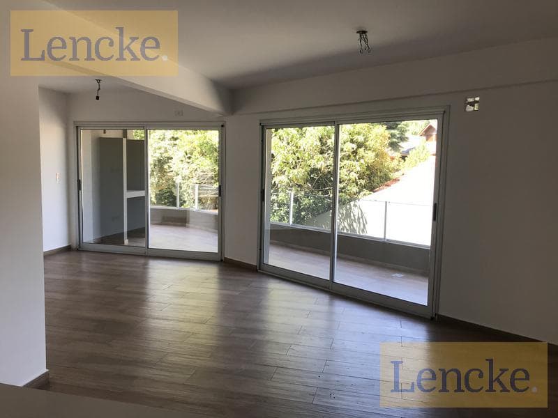 For sale with rental income: excellent 2-bedroom apartment with a balcony/terrace, barbecue, and garage